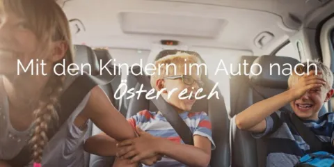Header Met kids in de auto naar AUT DE