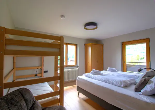 Landhaus Maier referentie slaapkamer met stapelbed
