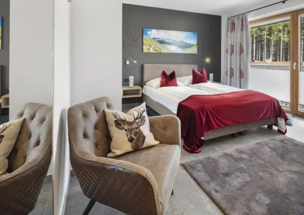 NK Chalet Blessachkopf slaapkamer met stoel