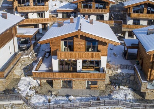 Nationalpark Chalet Grosser Happ Neukirchen - 
<ul>
  <li>Directe toegang tot oefenlift en nabijheid van skibus naar Wildkogel Arena en Zillertal Arena.</li>
  <li>Ontspanningsruimte met Finse sauna en knus haardvuur voor na het skiën.</li>
  <li>Ruime skiberging voor het opbergen van wintersportuitrusting.</li>
</ul>
