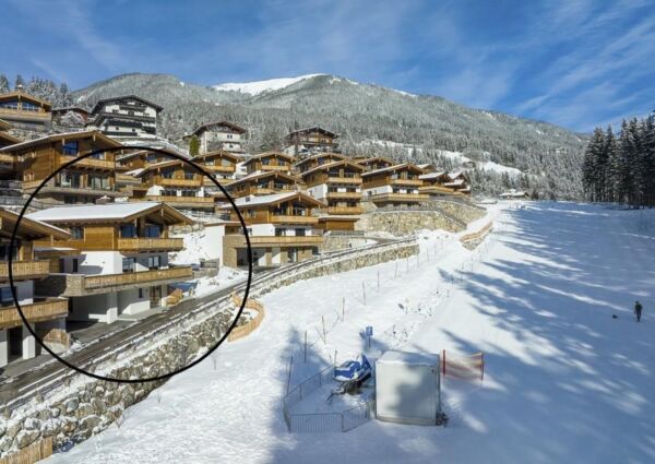Nationalpark Chalet Kreuzkogel Neukirchen - 
<ul>
  <li>Ski in & Ski out locatie met directe toegang tot de dalafdaling en sleeplift voor de deur.</li>
  <li>Comfortabele en luxe faciliteiten, inclusief Finse sauna en open haard.</li>
  <li>Toegang tot diverse skigebieden zoals Wildkogel Arena, Zillertal Arena en Kitzbuheler Alpen.</li>
</ul>