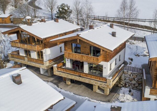 Nationalpark Chalet Kreuzspitze Neukirchen - 
<ul>
  <li>Directe toegang tot de dalafdaling van skigebied de Wildkogel Arena.</li>
  <li>Ruime skiberging met skischoendroger voor optimaal comfort na het skiën.</li>
  <li>Gratis skibus naar omliggende skigebieden en skischool/skiverhuur bij de receptie.</li>
</ul>