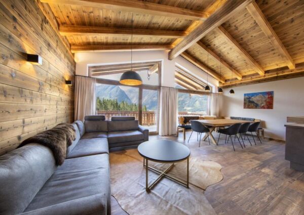 Nationalpark Chalet Ochsenbug Neukirchen - 
<ul>
  <li>Directe toegang tot de dalafdaling van het skigebied Wildkogel Arena.</li>
  <li>Uitgebreide ontspanningsmogelijkheden met sauna en luxe voorzieningen.</li>
  <li>Veelzijdige winteractiviteiten in de omgeving, zoals fakkelwandeltochten en rodelbanen.</li>
</ul>