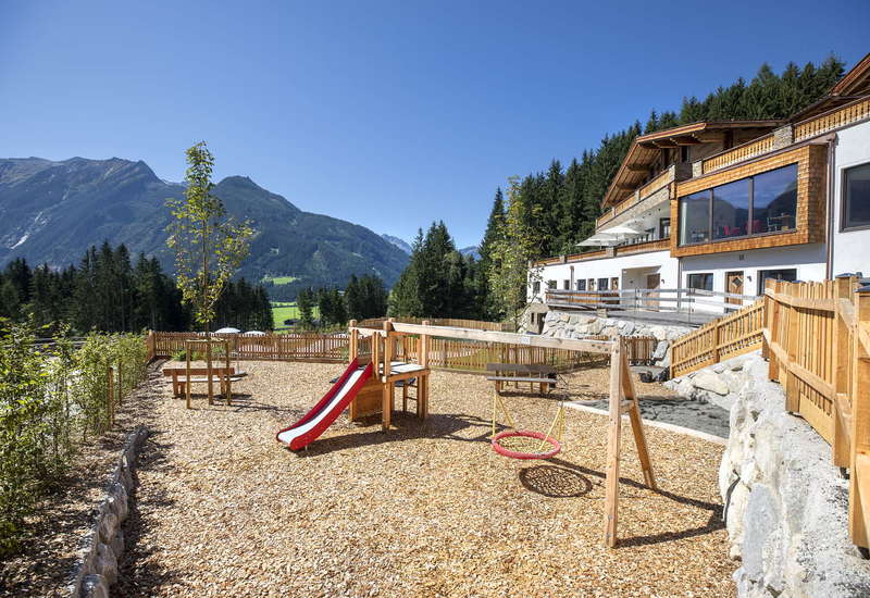 Playground and reception of the Nationalpark Chalets